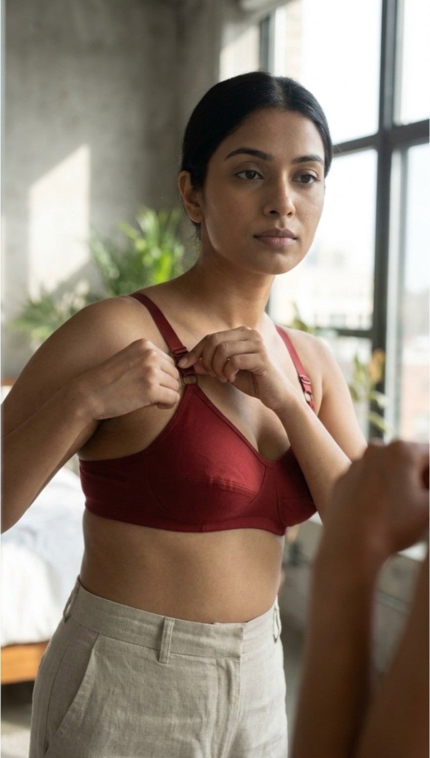 Maroon cotton bra by a window